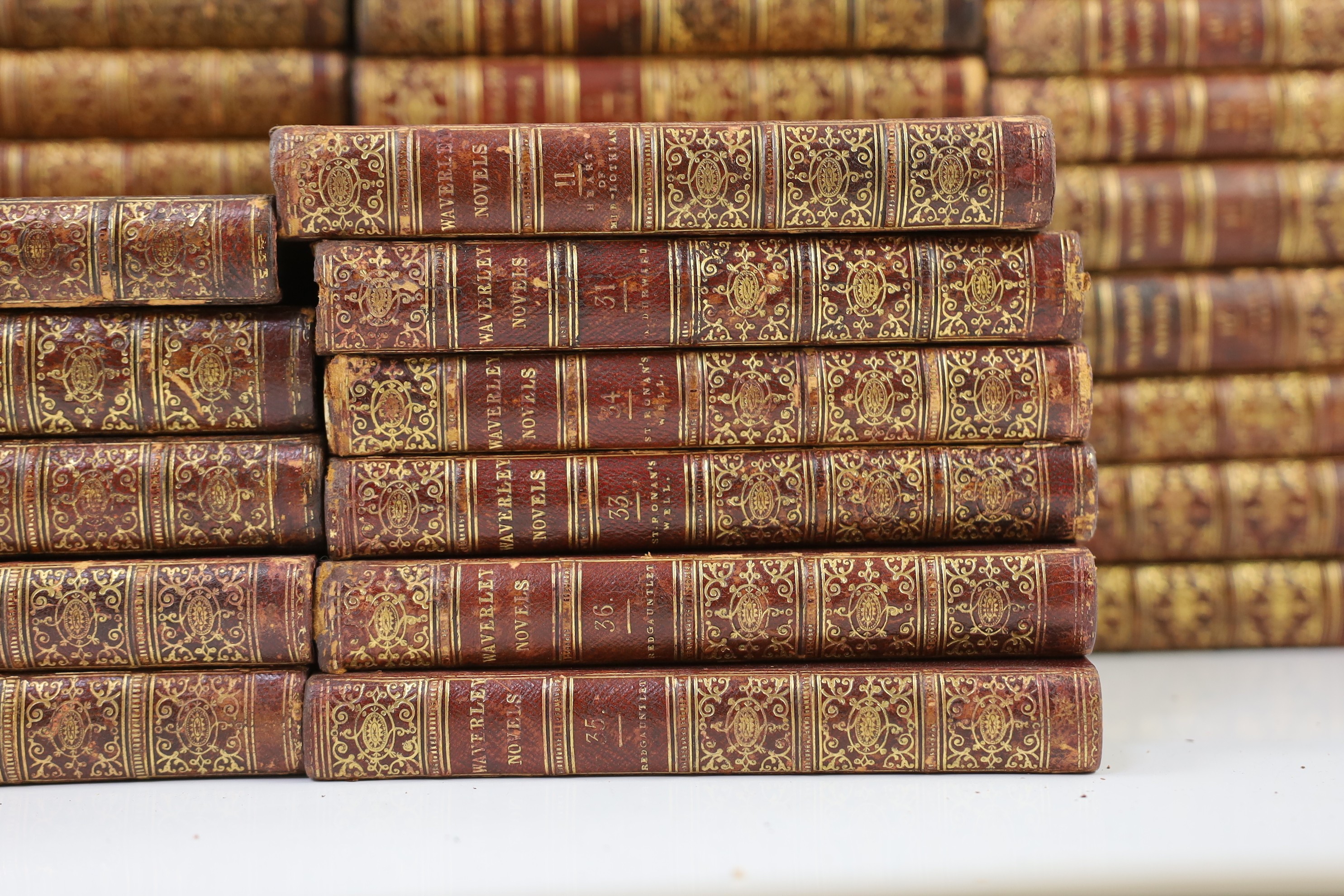 Scott, Sir Walker - Waverley Novels, 48 vols., engraved pictorial and printed titles, frontispieces; contemp. gilt-decorated maroon half morocco and marbled boards with panelled spines, marbled edges and e/ps., sm.8vo. E